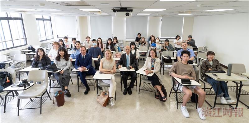 Former French Member of Parliament Michel Hunault (center) poses for a group photo with students from the Department of French.