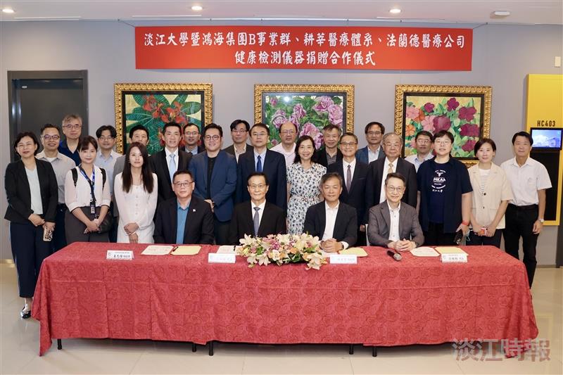 Group photo taken after the signing ceremony.
