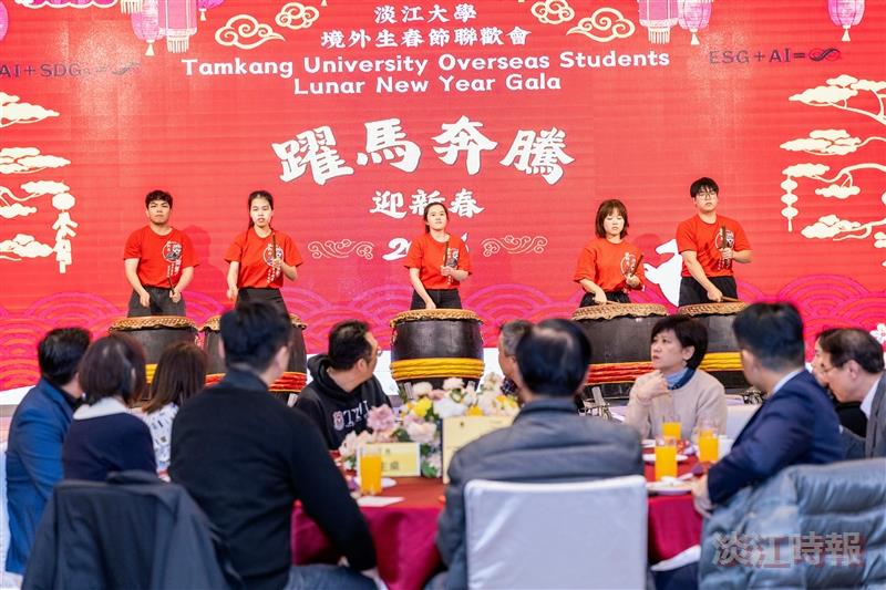 The lion dance troupe opened the celebration with the ceremonial beating of gongs and drums.