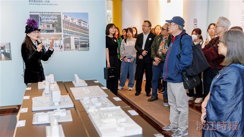 Curator Tsung-Ching Hu (left), Assistant Professor of Architecture at National Taipei University of Technology, guided visitors through the exhibition.