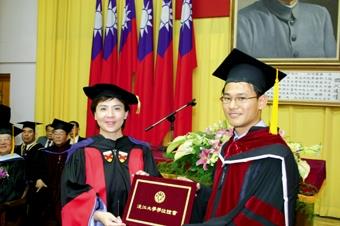 The graduation ceremony was held on June 4, 2005. President Dr. Chang give every PhD graduates their diplomas.