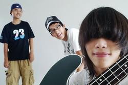 The Departmental Song “Dream in Hand,” by Jin-hui Hu (left, music composer), Wu-yan Tsai (center, leading singer) from the Department of Information and Communication and Kai-bo Shi (right, bass-guitarist) from the Department of Computer Science and Information Engineering won the first prize at The Grand Contest for the Flower of Youth Heart Music Lyric Composition.