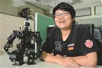 胡越陽與機器人小黑，譜出「人機奇緣」的特殊緣份。（攝影／羅廣群）