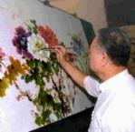 名畫家戴子超現場揮毫牡丹畫作《富貴春》，不到一小時就完成精美畫作，莫不讚嘆大師功力。（張佳萱攝）